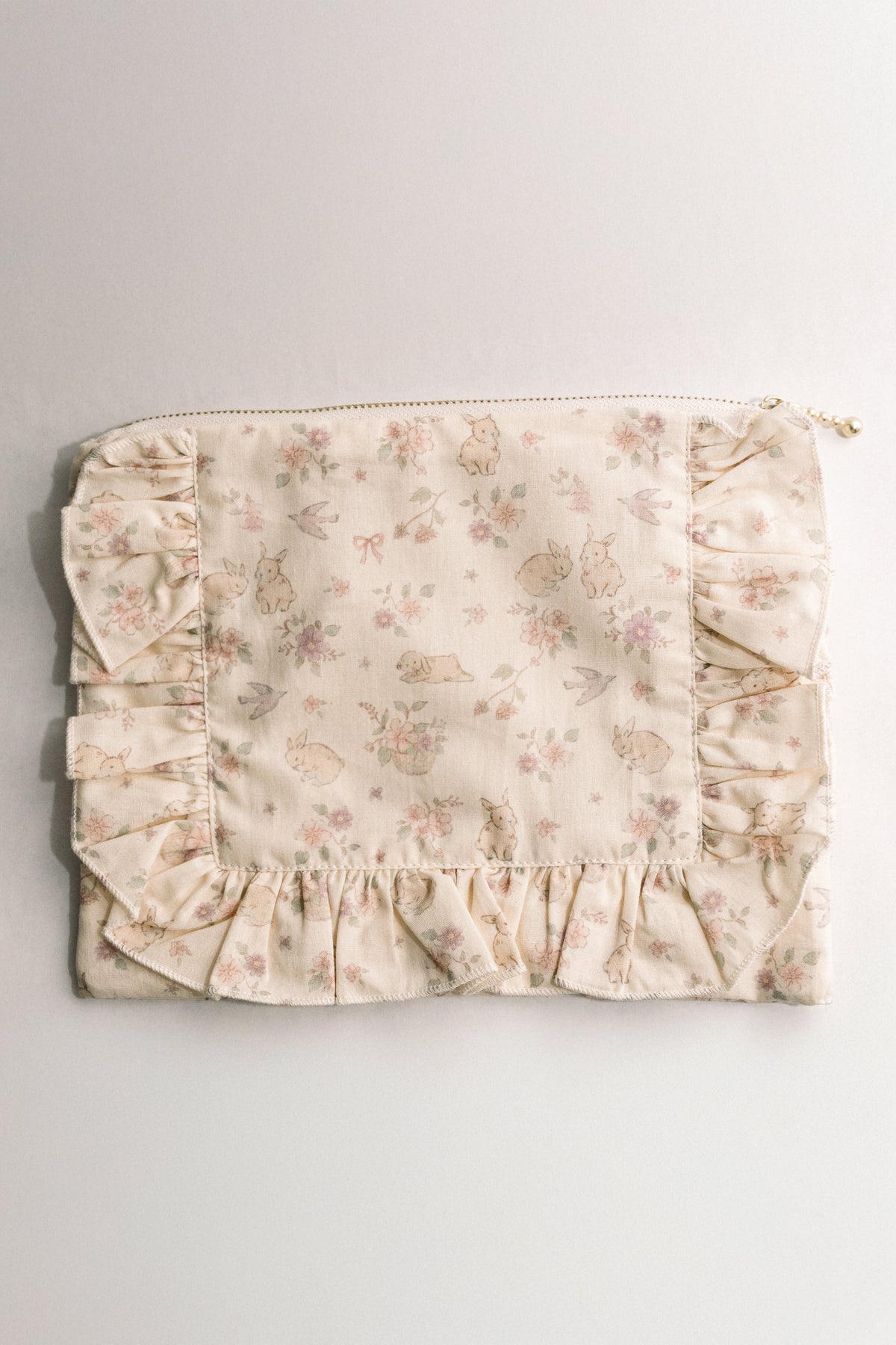 Woodland bunny floral ruffle pouch front with gathered bottom ruffle and zipper pull