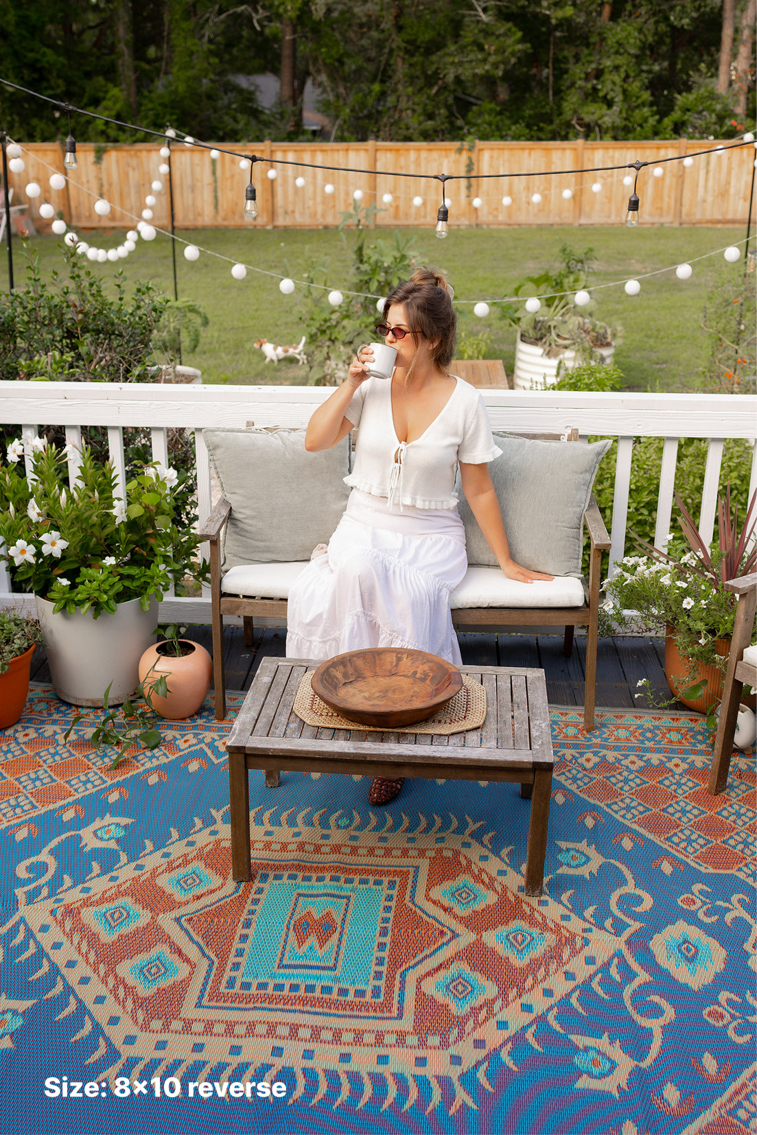 Turkish-style area rug outdoors with blue geometric pattern; Size 8x10 reverse