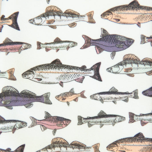 Fish-pattern fabric on lady hair bow, close-up of colorful fish shapes