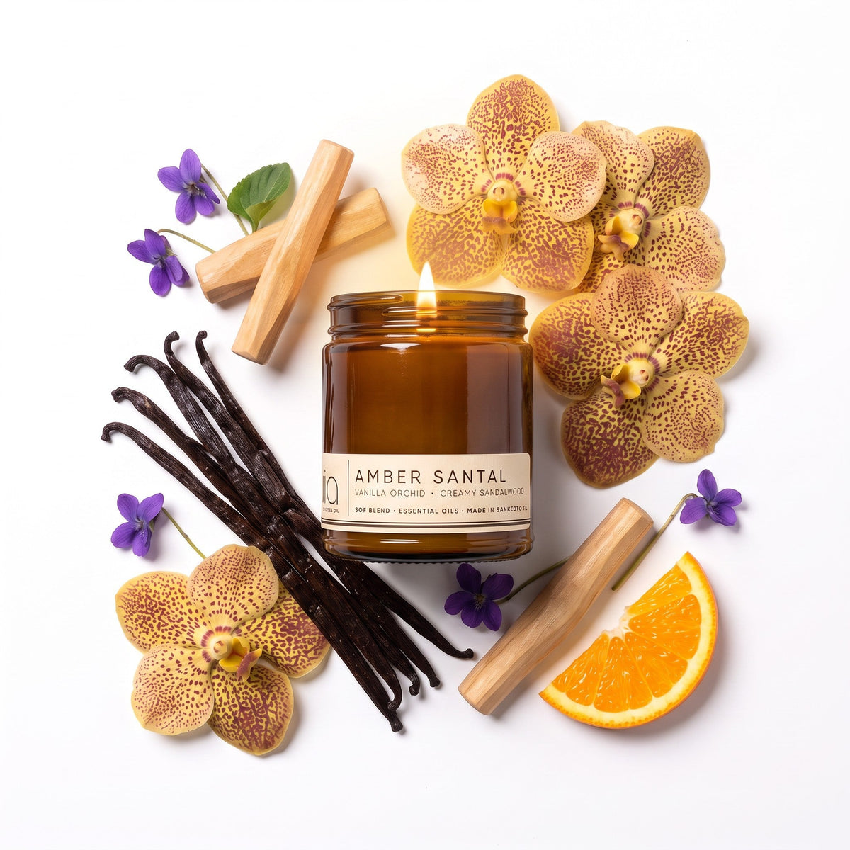 Amber Santal candle in an amber jar with vanilla beans, cinnamon sticks, orchids, and orange.