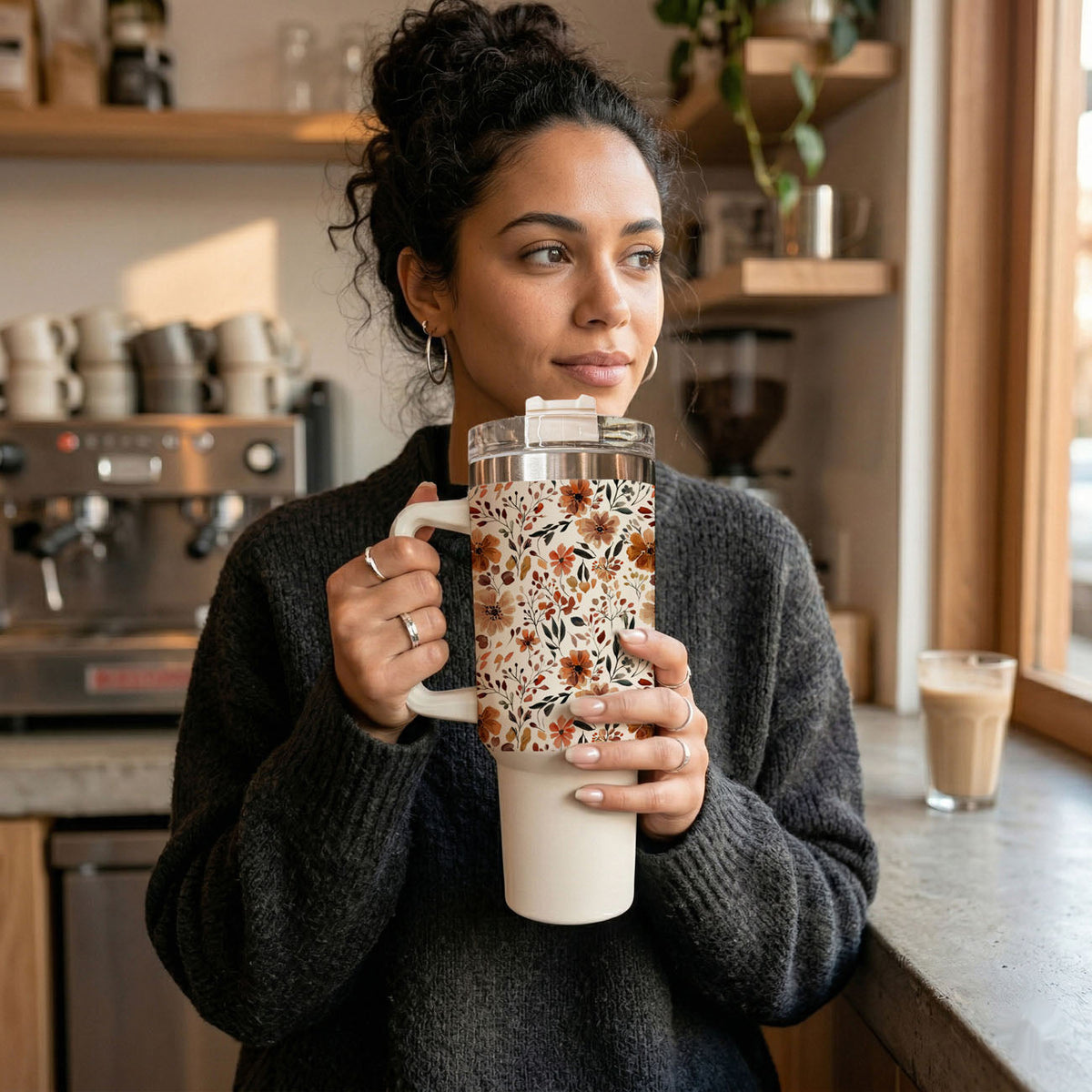 Floral 40oz tumbler close-up with floral sleeve, clear lid and straw, white handle