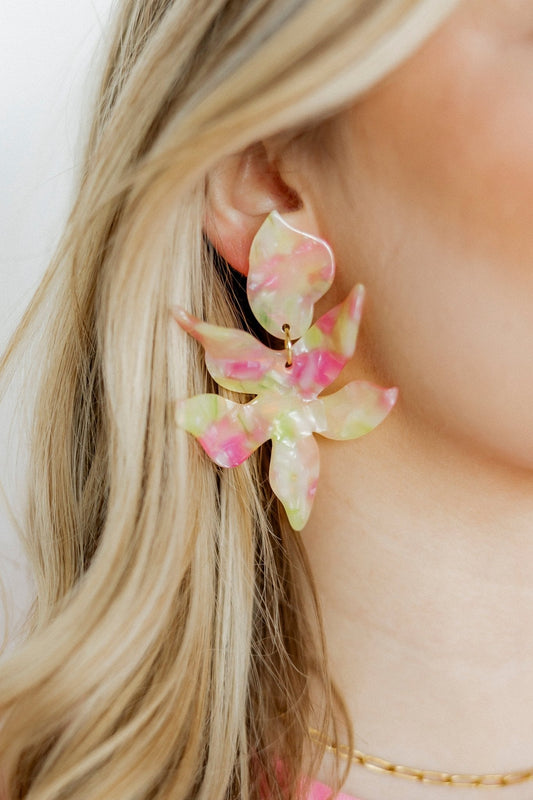 Floral earrings in pastel pink and lime with gold hoop hardware, side view