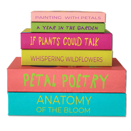 Floral canvas storage book box with stacked colorful books and visible book spines