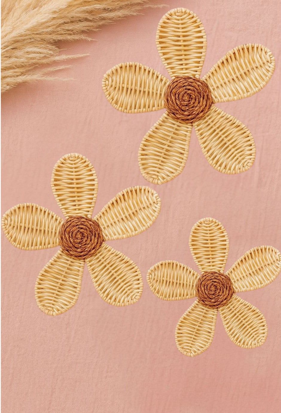 Natural rattan daisy wall decor with woven petals and coiled centers