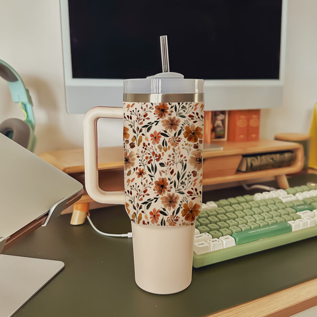40oz floral insulated tumbler with handle, clear lid, and straw on office desk