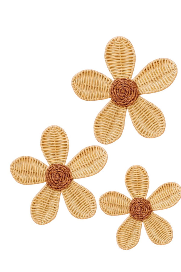 Three natural rattan daisies with woven petals and coiled centers