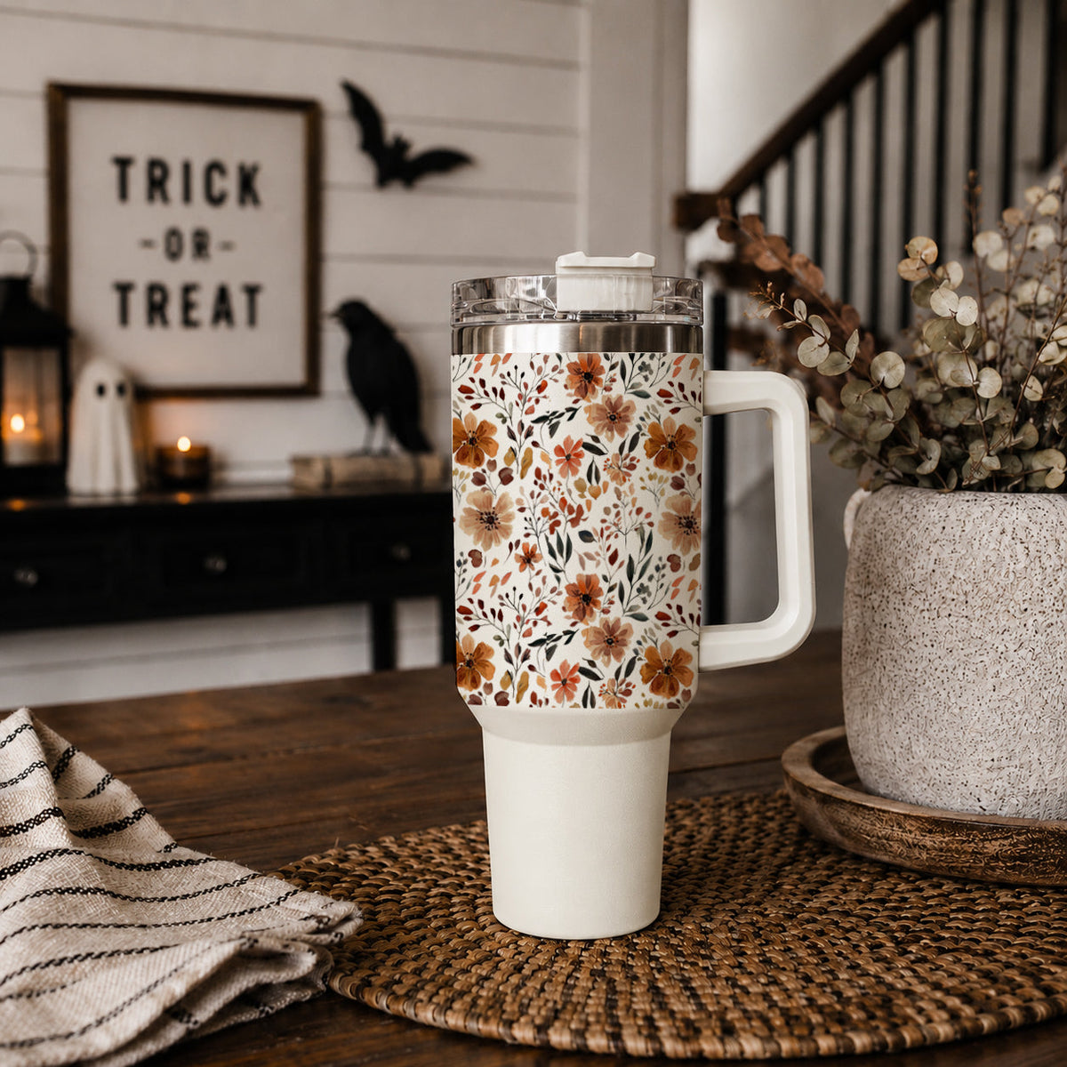 40oz floral insulated tumbler with handle, clear lid, and straw standing upright