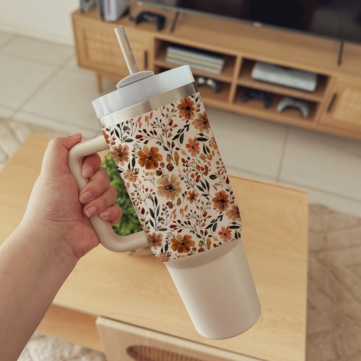 Floral 40oz tumbler with white lid, floral autumn pattern, straw, and side handle