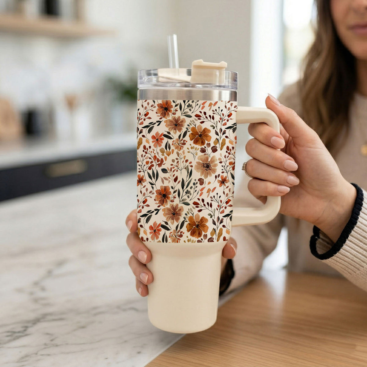 White travel tumbler with clear lid and straw; autumn floral sleeve pattern