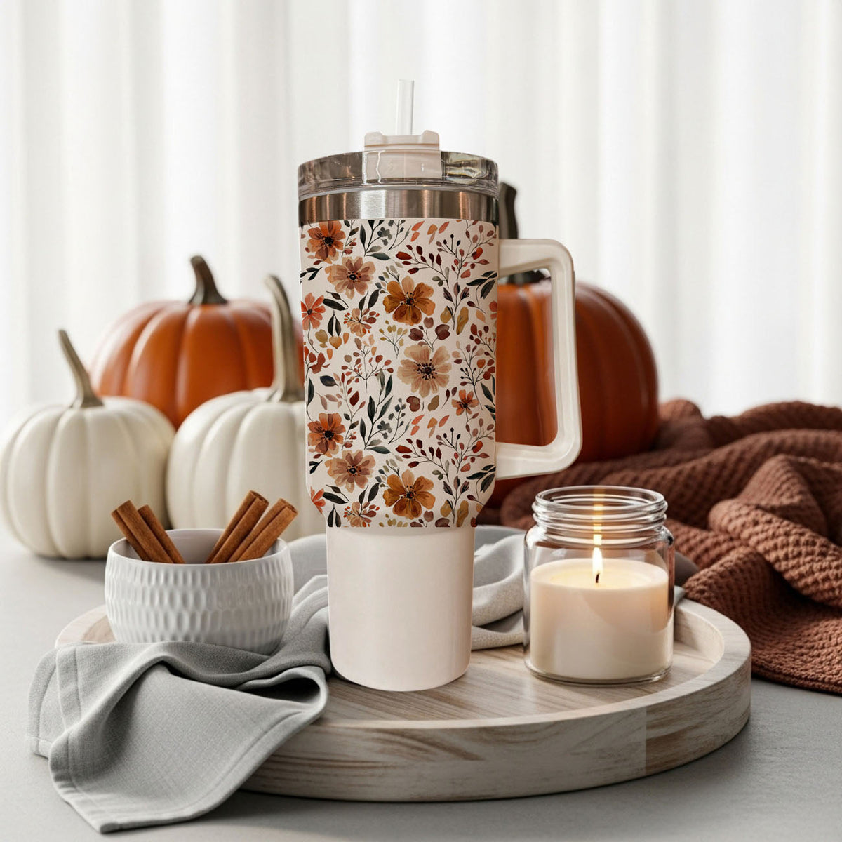 Floral 40oz tumbler on tray with autumn flower print, clear lid, straw, and handle