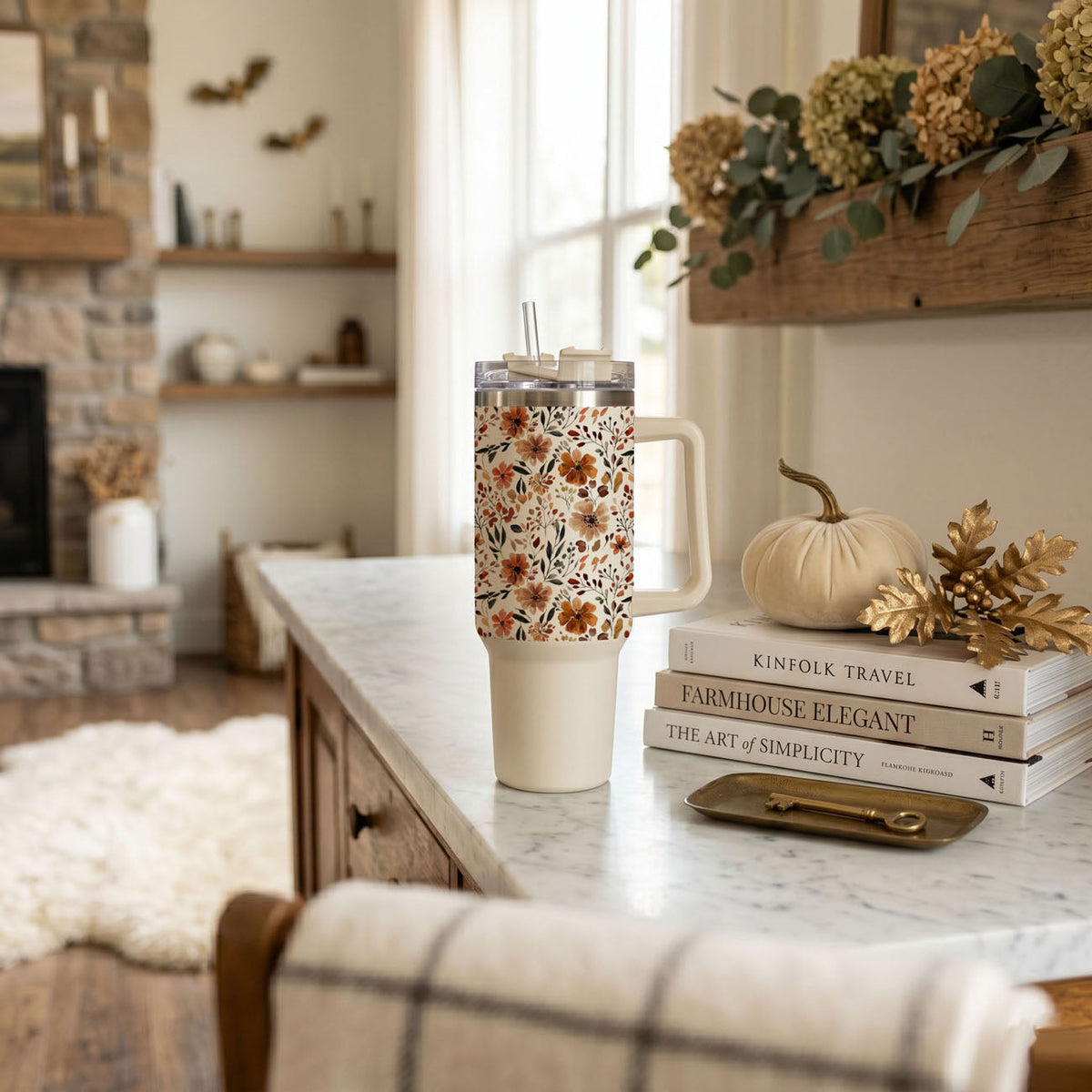 Autumn floral 40oz tumbler with straw and clear lid on kitchen counter