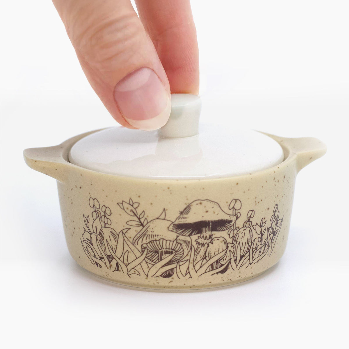 Beige ceramic casserole-style trinket box with lid, forest animal line art on sides