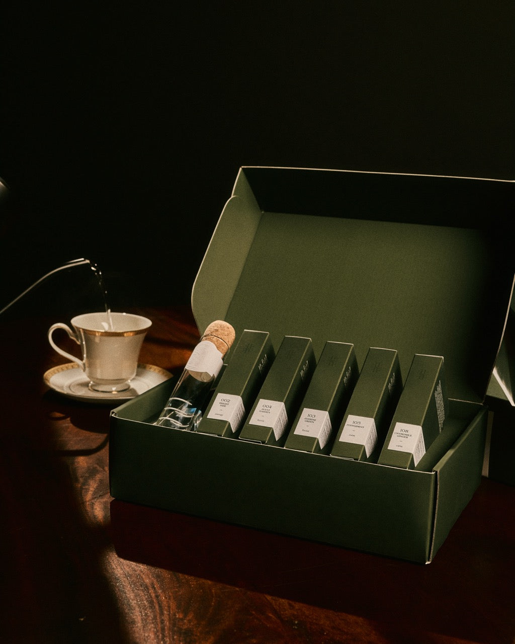 Open green discovery set tray with glass vials and printed labels