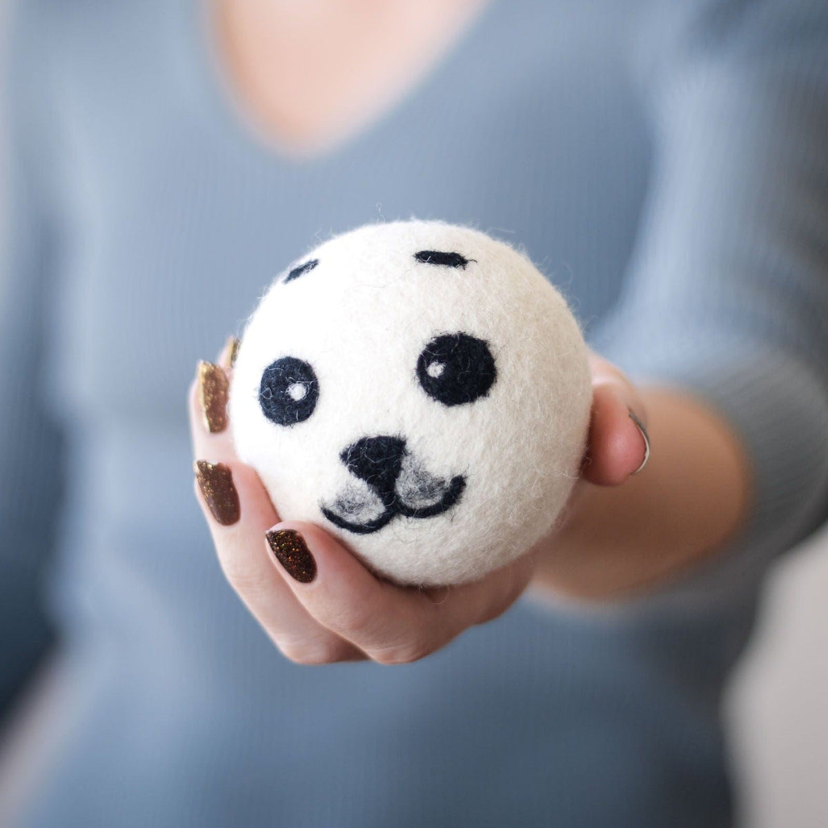 Single round panda plush toy with black eyes, nose, and stitched mouth