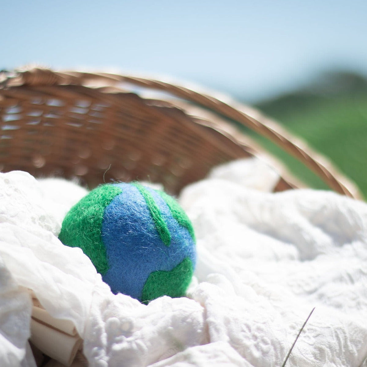 Single felt globe plush ball with blue-and-green planet design