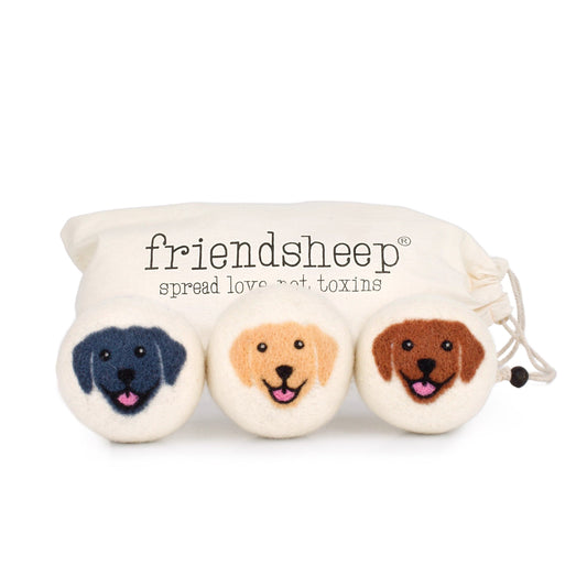 Felt dog-face patches in a rolled pouch, three embroidered heads and drawstring tie.