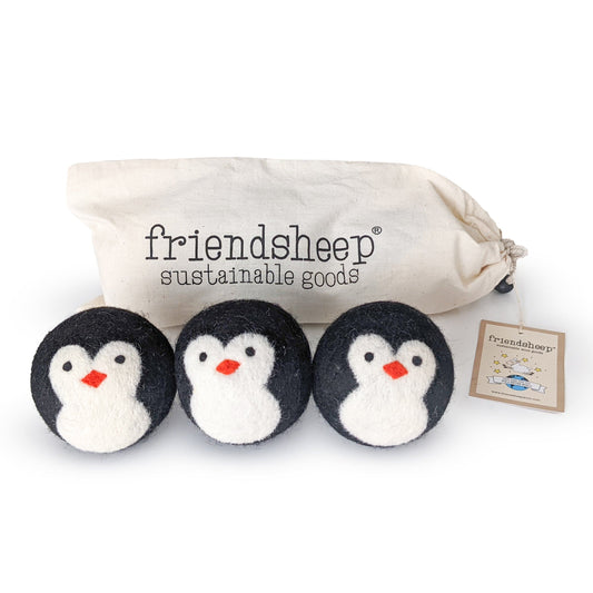 Penguin plush trio with fabric pouch and three small black-and-white penguins