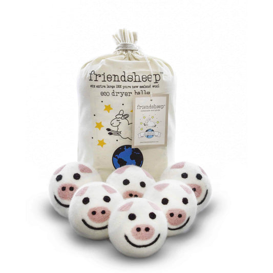 Eco-friendly felt pig-shaped dryer balls set in a drawstring bag