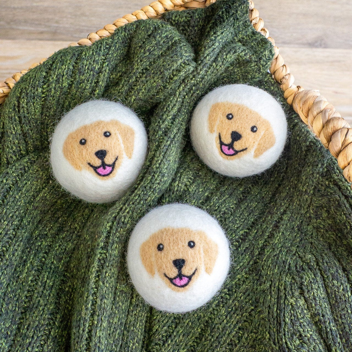 Plush dog face patches on textured green knit fabric with braided handle