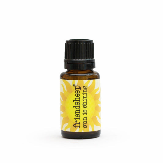 Amber essential oil blend bottle with black ribbed cap and yellow flower label.
