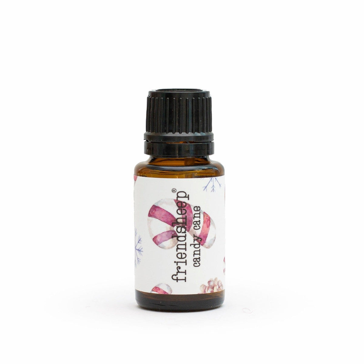 Amber essential oil bottle with black ribbed cap; label shows candy cane text.