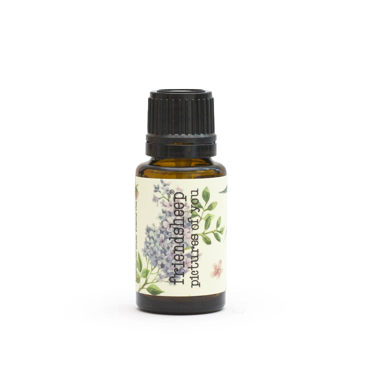 Amber essential oil bottle with ribbed black cap and botanical label