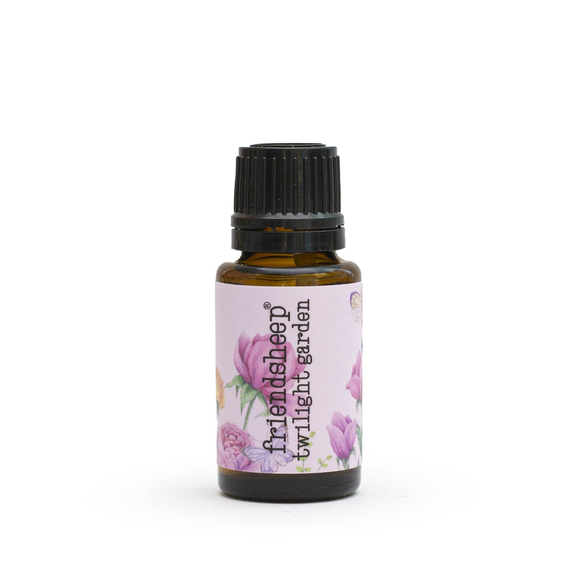 Amber glass essential oil blend bottle with ribbed black cap and floral label.