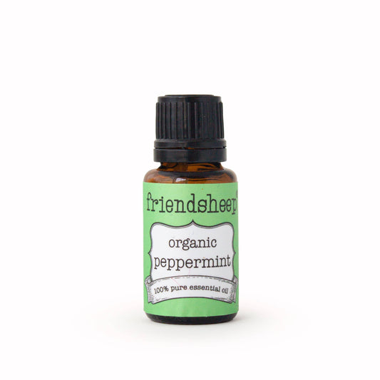 Organic peppermint essential oil bottle with black cap and green label