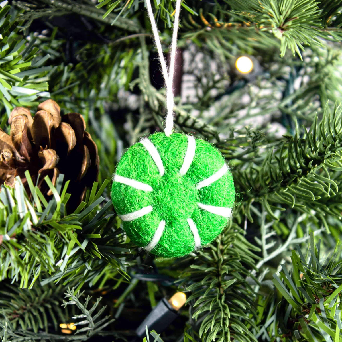 Green felt peppermint swirl eco freshener ornament with white ring and striped segments