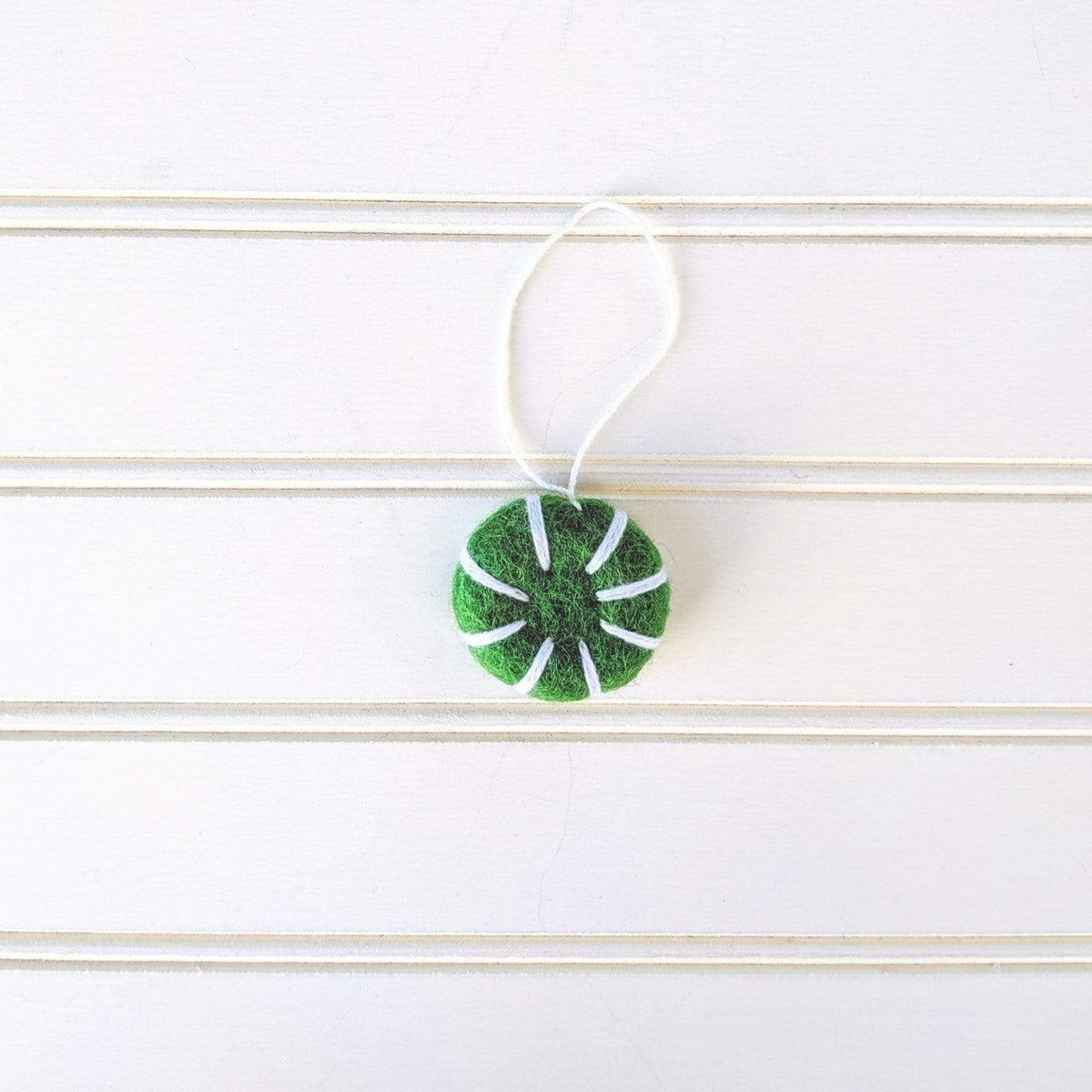 Small green-and-white felt peppermint swirl eco freshener ornament with hanging cord
