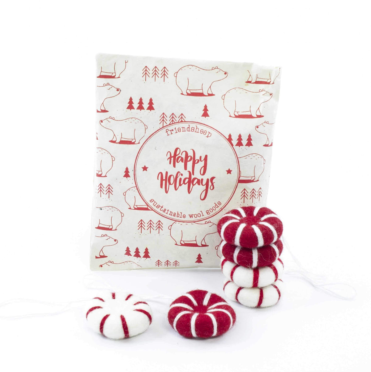 Red and white felt peppermint ornament fresheners, shown with several round pieces