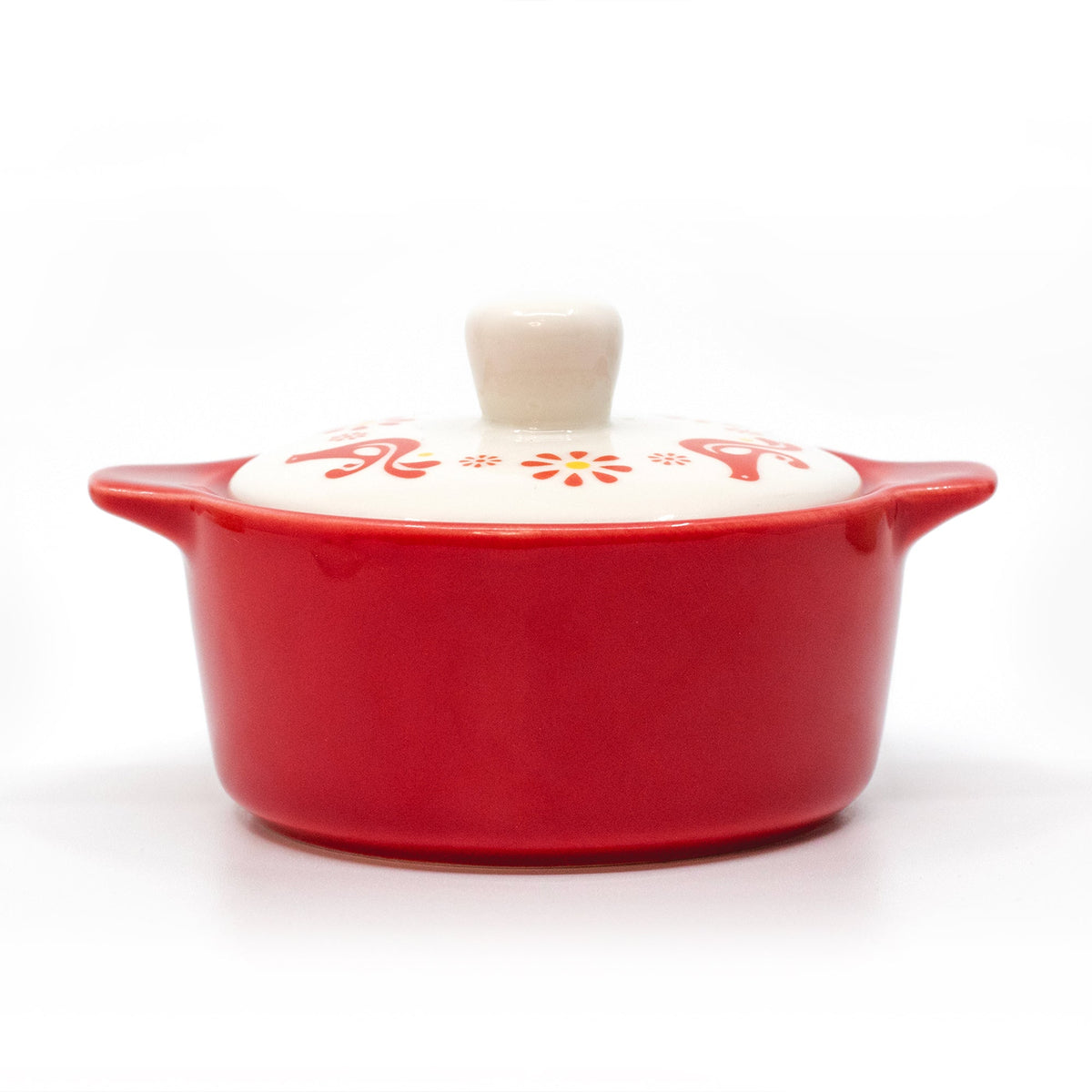 Red ceramic casserole trinket box with white lid and knob; front view.