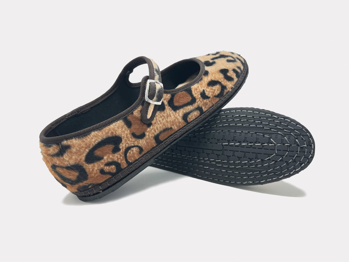 Leopard print Mary Jane flats with buckled strap and textured dark sole