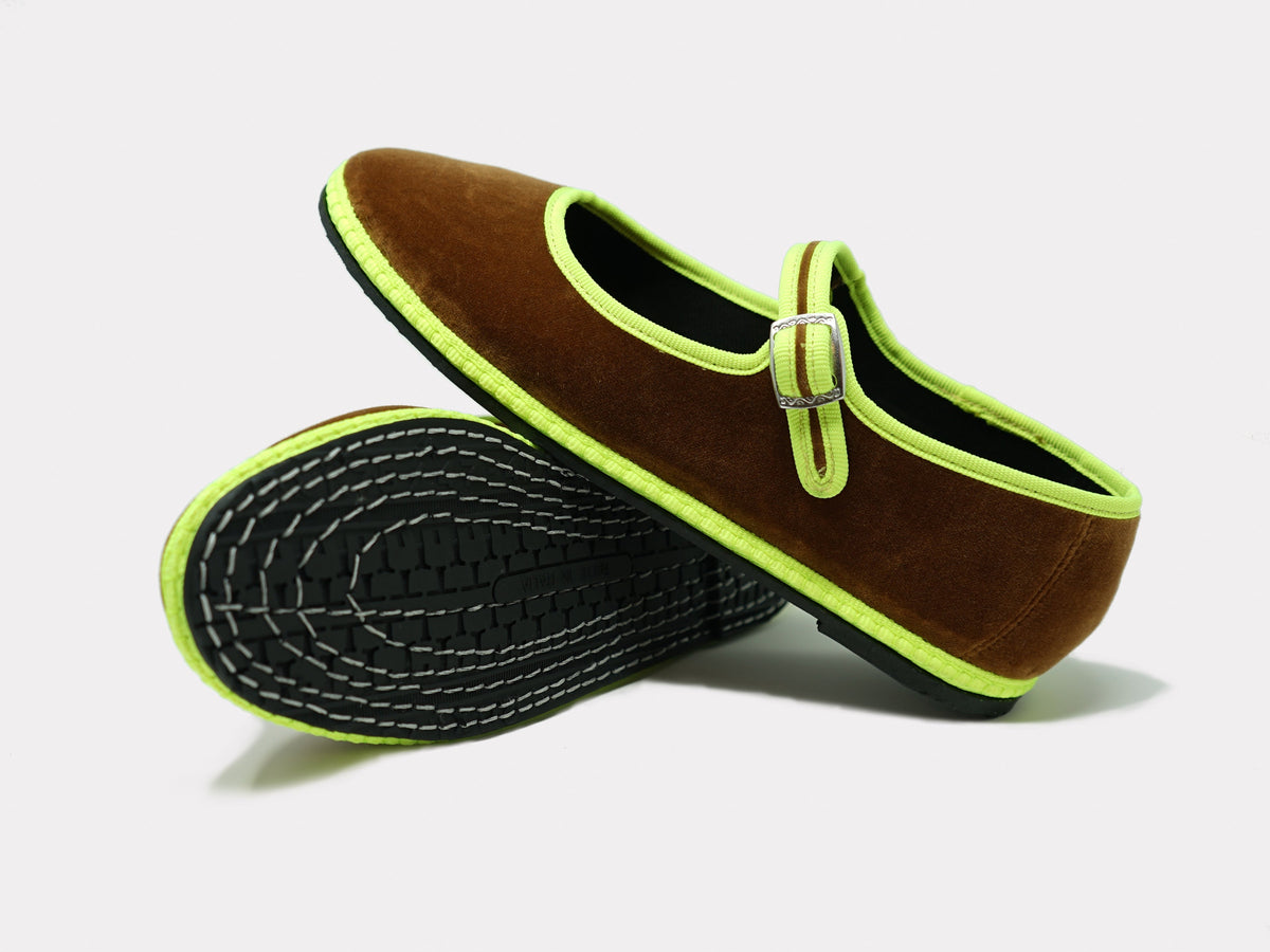 Camel suede Mary Jane flats with neon green trim and stitched sole detail