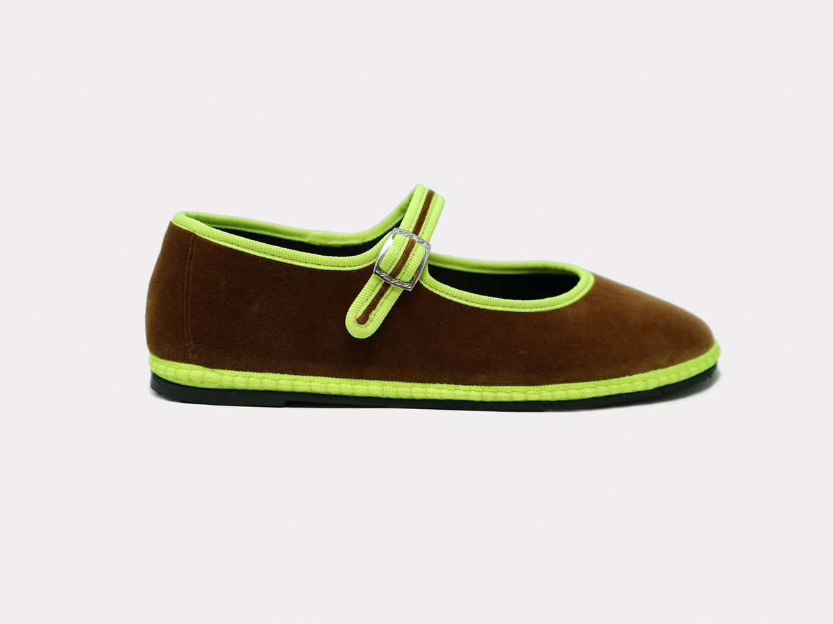 Camel suede Mary Jane flats with neon green trim and side strap