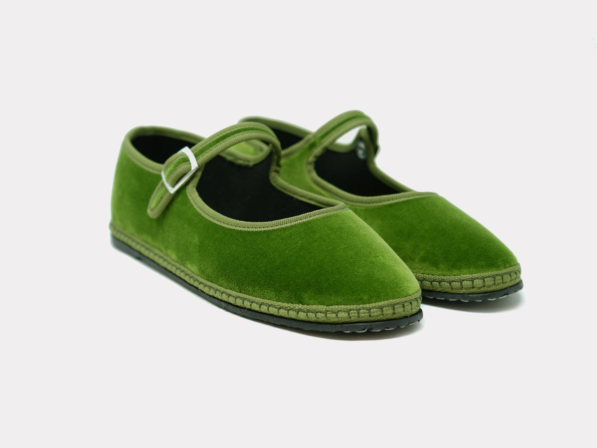 Sage green suede Mary Jane flats with rounded toe and adjustable strap