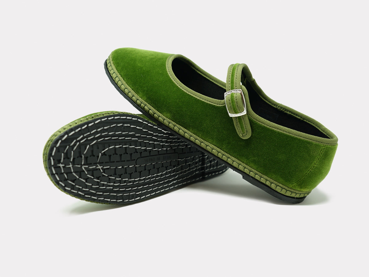 Sage green Mary Jane flats with contrast stitching and textured outsole