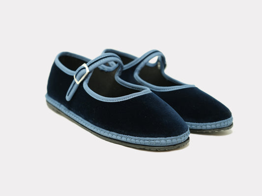 Navy Mary Jane flats with light blue strap and buckle, stitched outsole