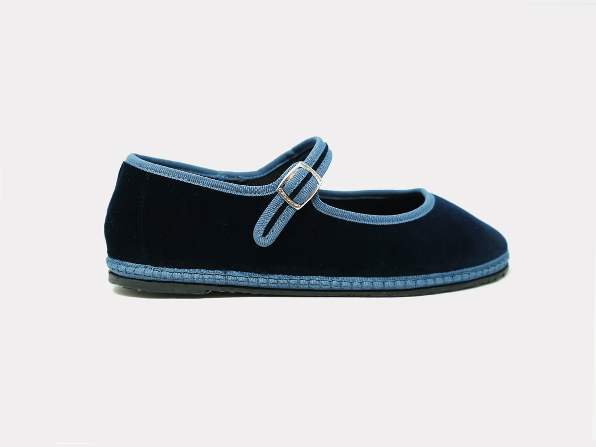 Navy Mary Jane flats with light blue strap and metal buckle, low profile sole