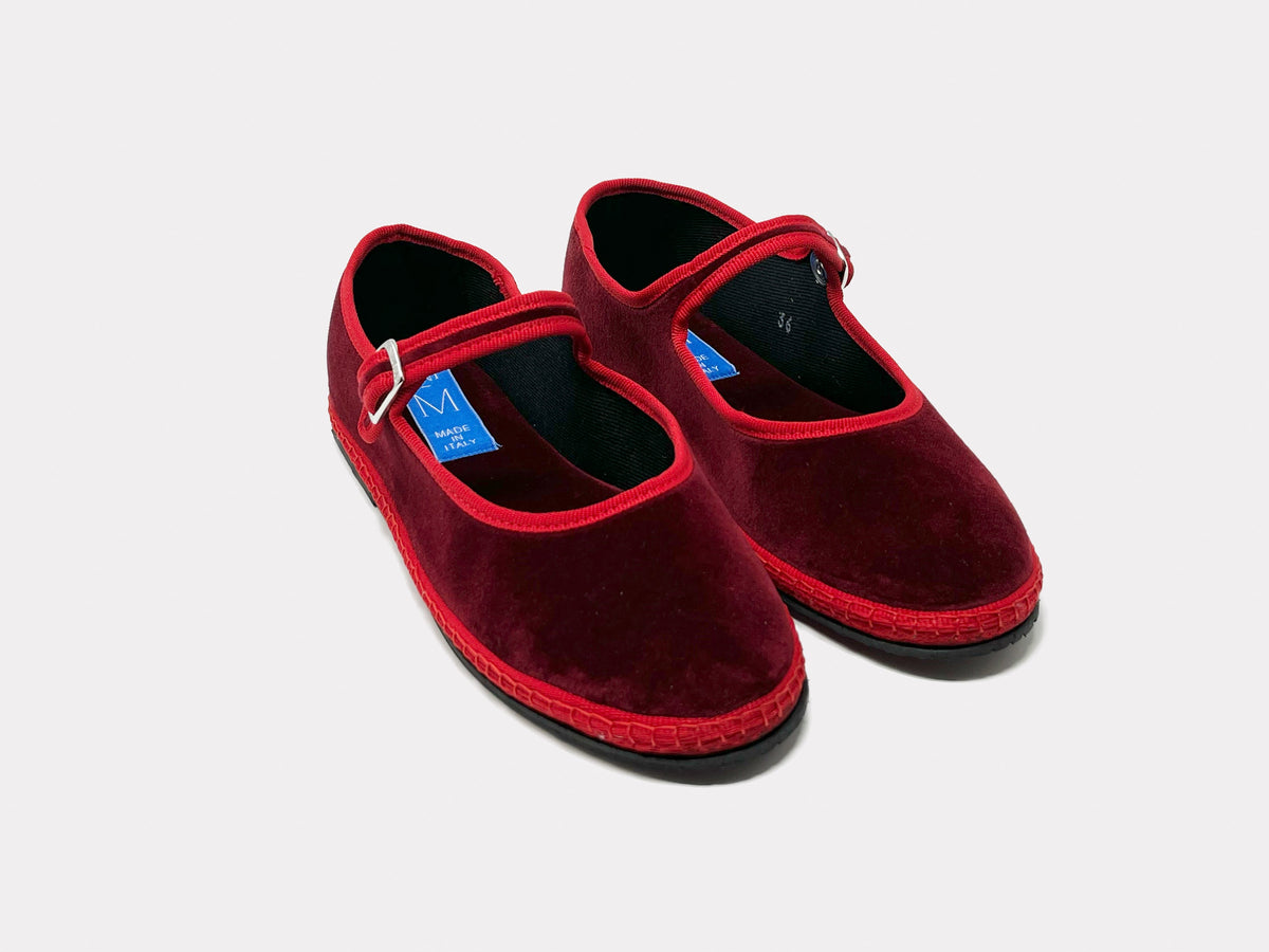 Burgundy Mary Jane suede flats with red strap and buckle detail