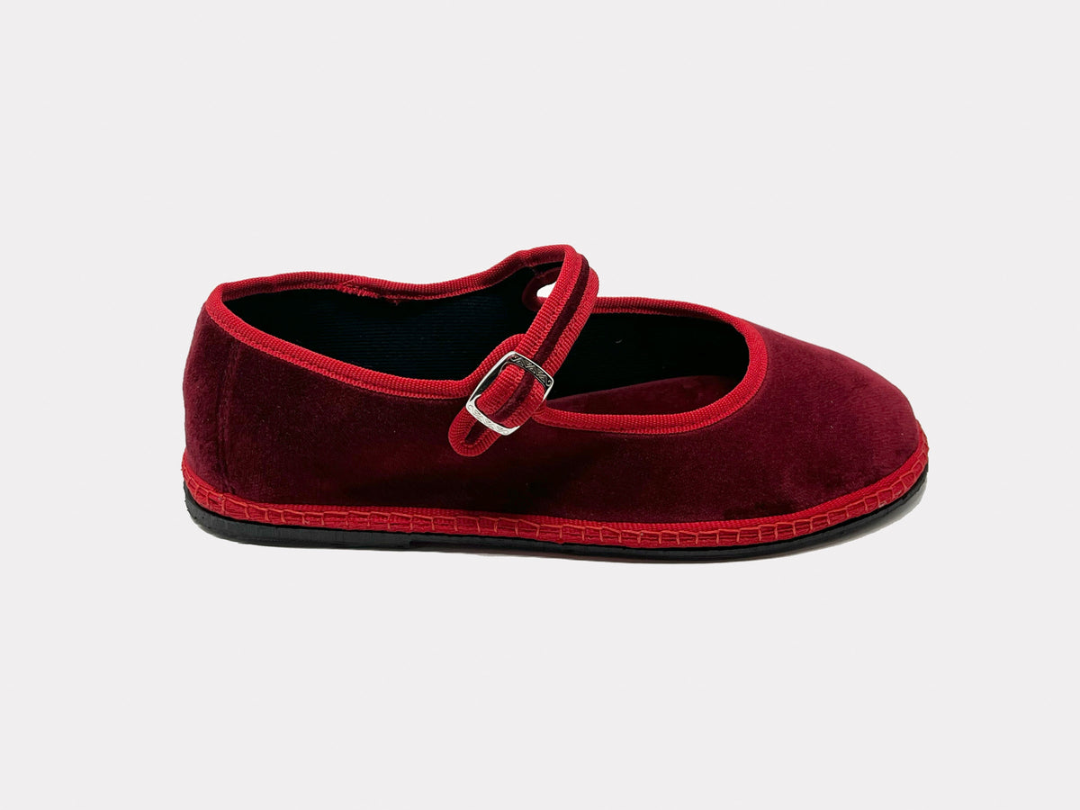 Burgundy Mary Jane suede flat with adjustable strap and metal buckle