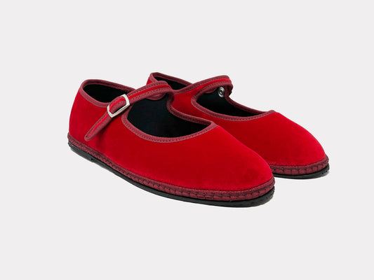 Red Mary Jane flats with buckle ankle strap and textured sole