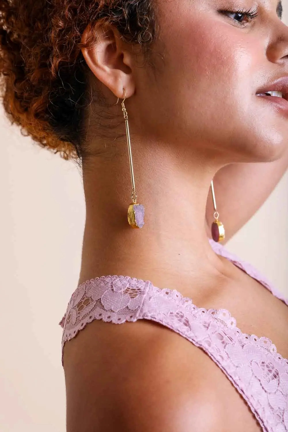 Gold-tone gemstone drop earrings with oval amber-orange stones and long hooks