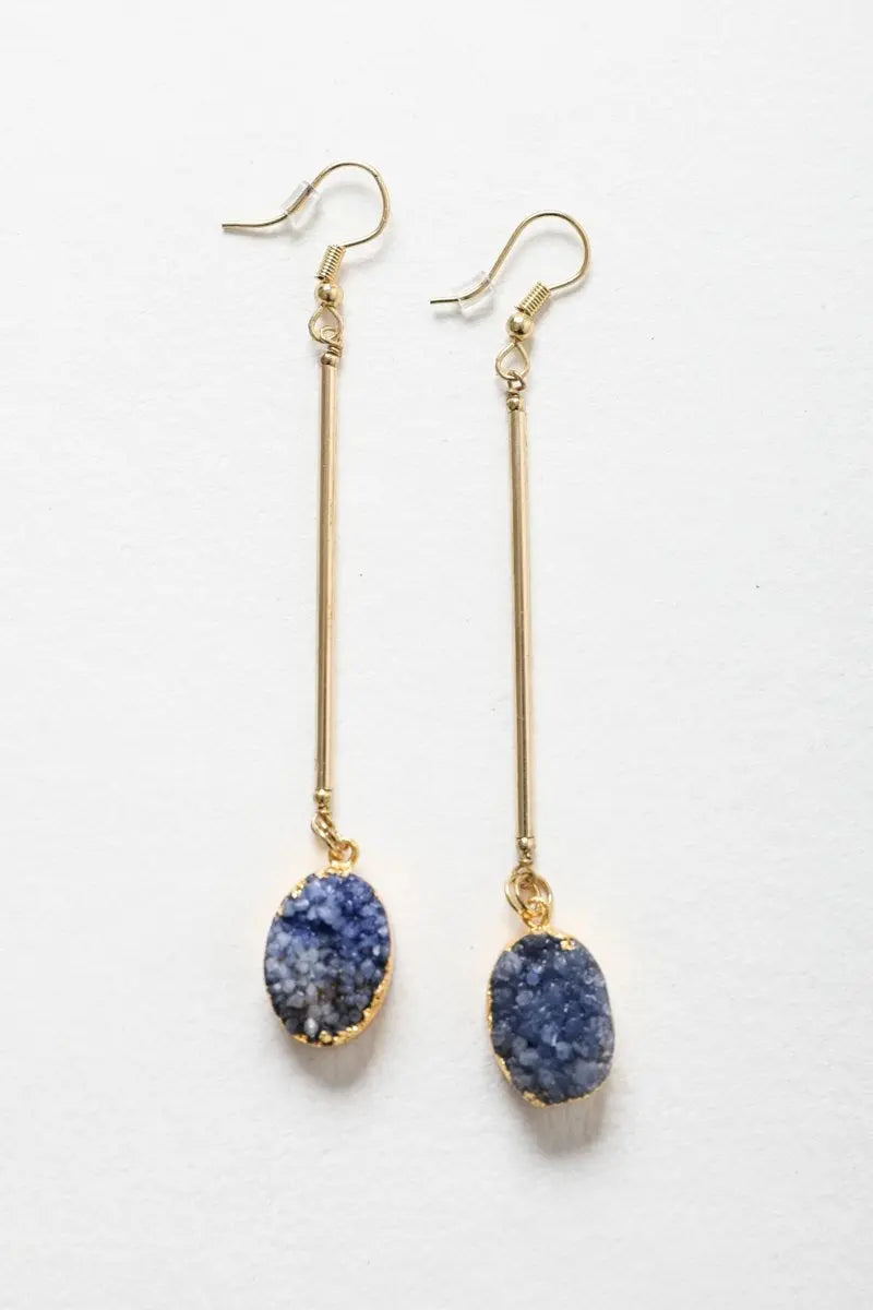 Gold-tone gemstone drop earrings with oval blue stones on slim gold bars