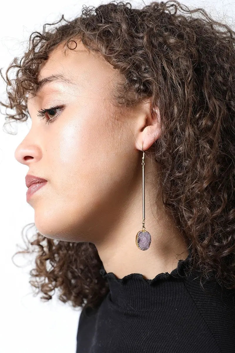 Gold-tone gemstone drop earrings with small purple oval stones and thin gold hooks