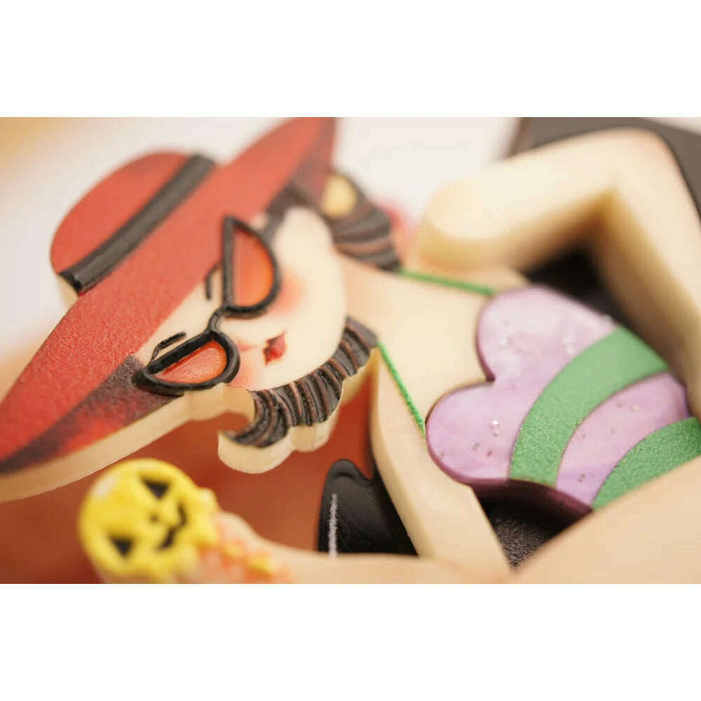 Close-up girl on swan float brooch: red hat, glasses, purple and green dress