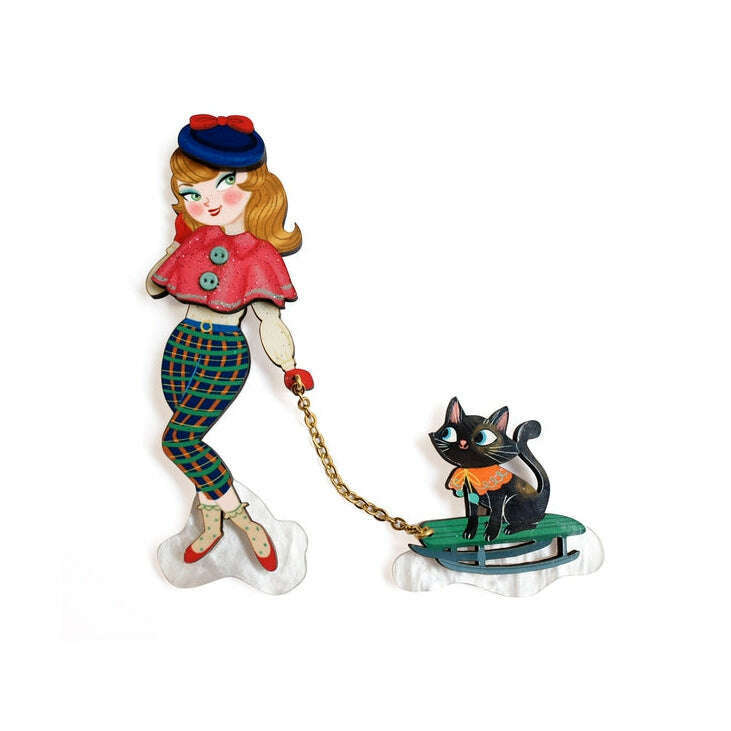 Girl and cat on sled enamel brooch with gold-tone chain detail