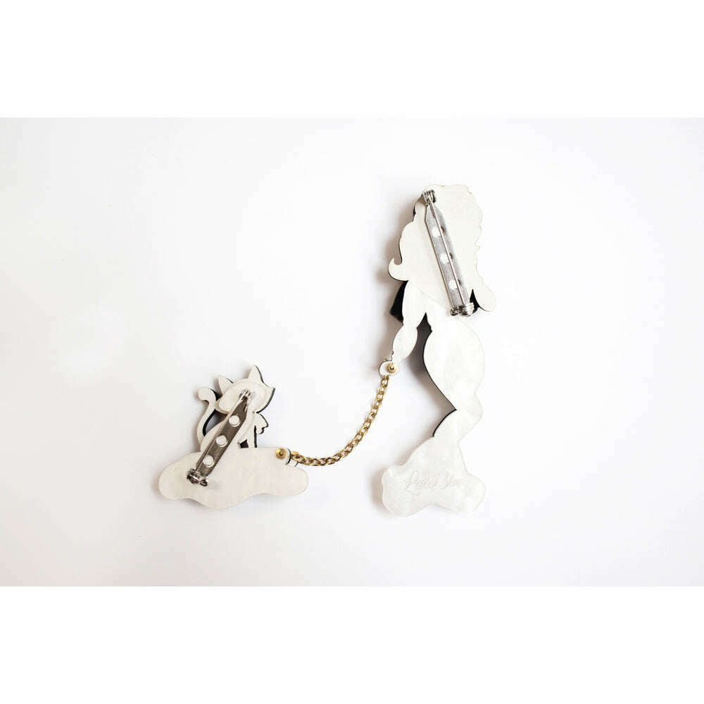 Back view of girl and cat on sled enamel brooch with clasp