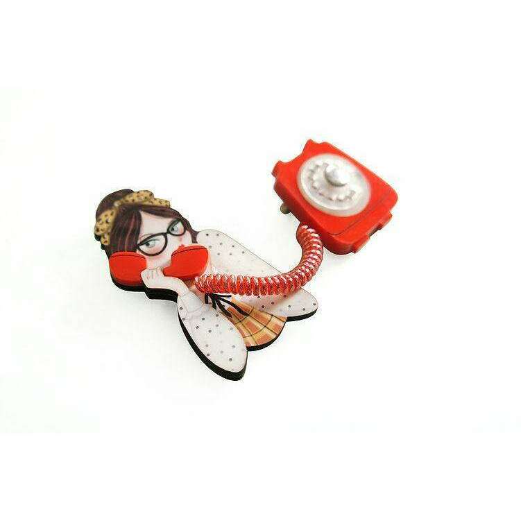 Girl phone collar clip brooch showing a girl holding a red rotary telephone on a cord