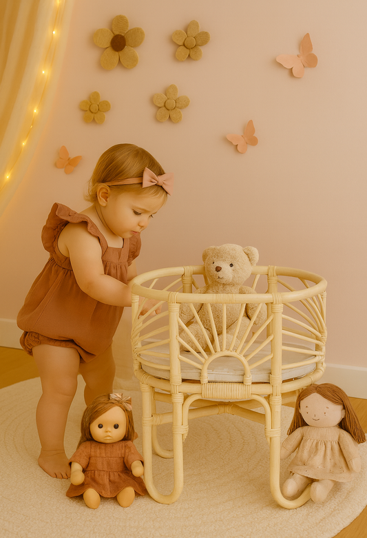 Handmade toy bassinet with woven rattan-style frame and curved legs